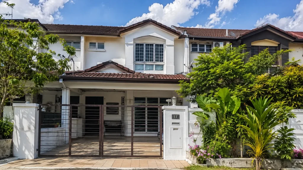 Freshly painted exterior wall of a Malaysian double-storey terrace house after proper priming and repainting